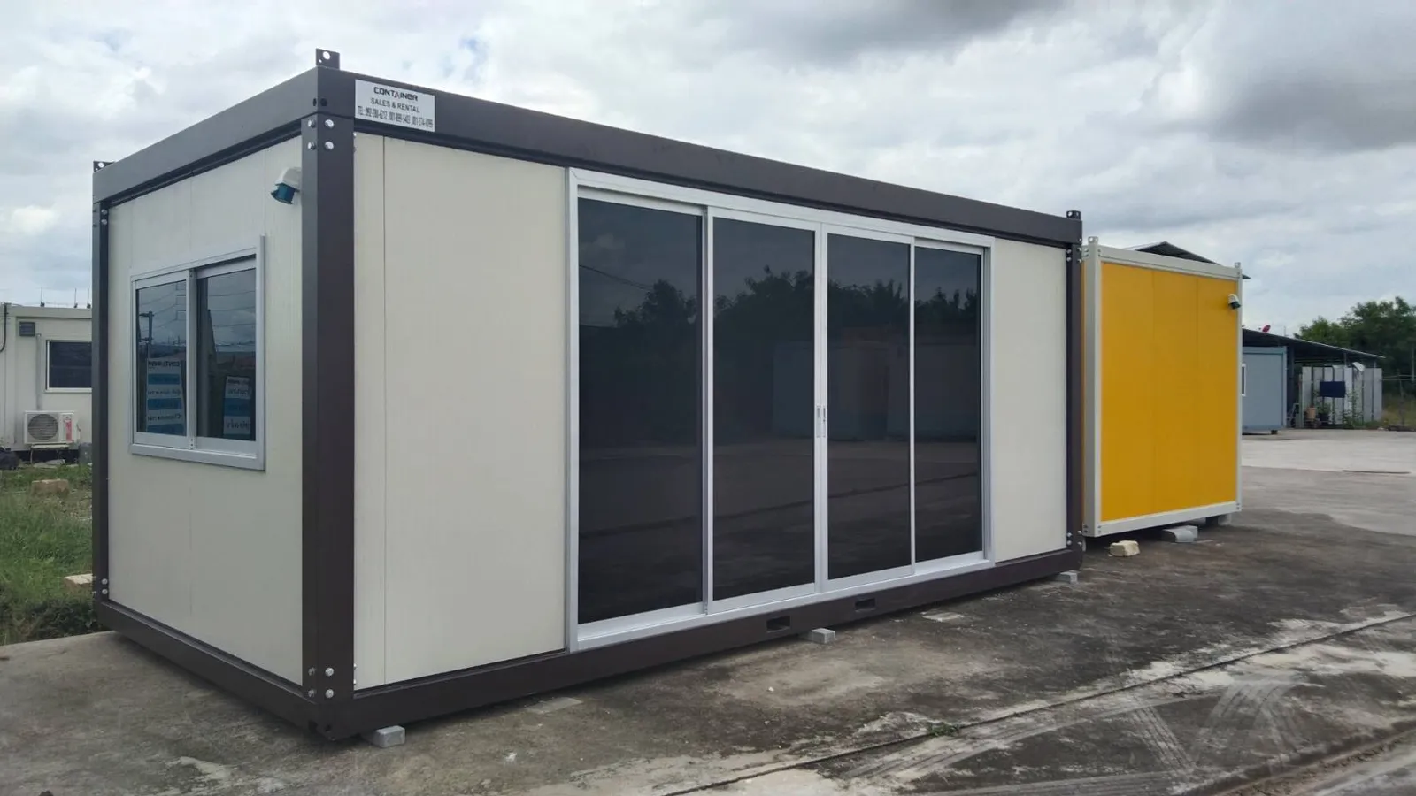 Knock-down office unit with cream walls, dark-brown frame and four sliding glass doors (view 3)